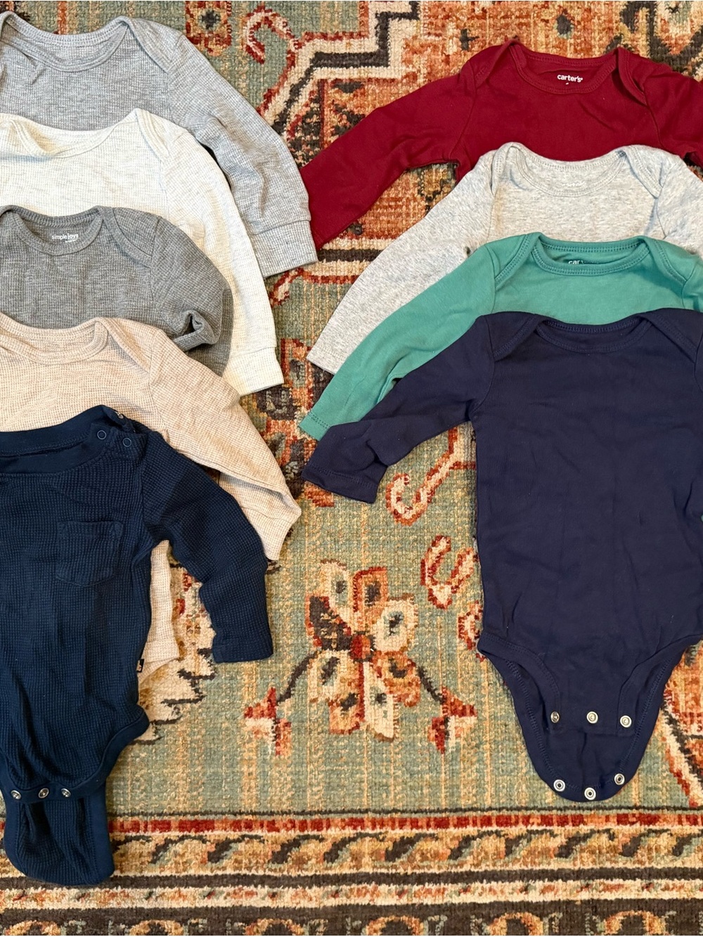Carter's Long-Sleeve Baby Onesies in Navy, Red, Green, Gray, Cream, Beige
